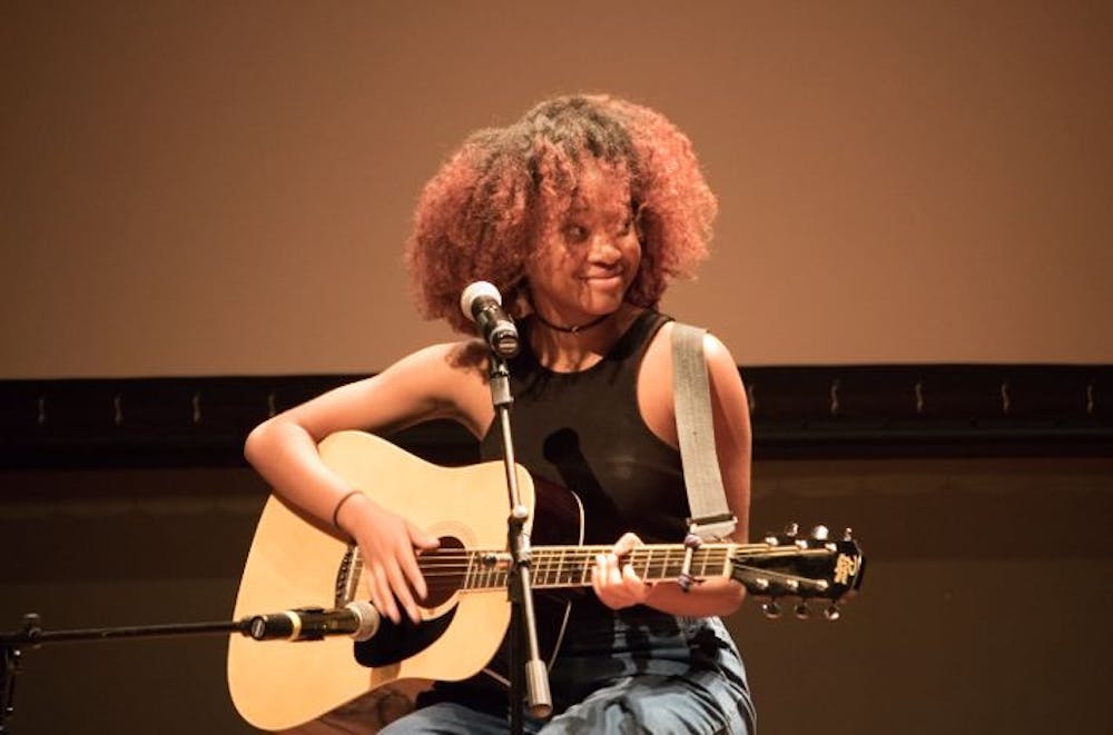 <p><strong>Singer and guitarist Precious Okoro plays a song titled “Delirious.” Okoro was the only performer to not use an instrumental backing track at the event.</strong></p>