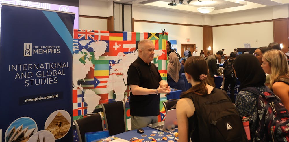 <p>Students gather information at the International and Global Studies booth during the University of Memphis’ Explore Your Major Day.</p>