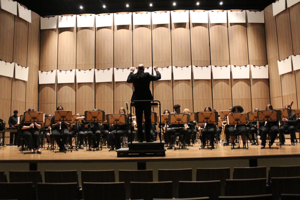 Ron Nelson conducts for the symphonic band’s ”Homage” concert. Photo credit to Darien Anderson.