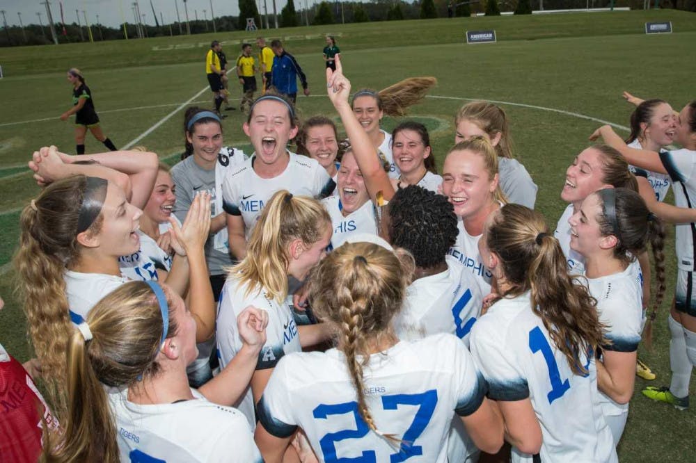 <p>The Memphis women's soccer team celebrates after Clarissa Larisey's second goal in the AAC championship game. The team went on to beat USF 3-0 in the AAC championship match.</p>