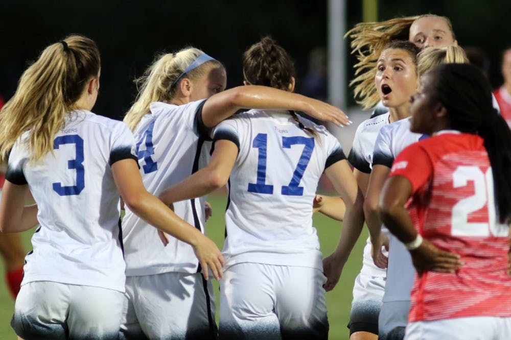 <p>The U of M women's soccer team celebrates after Clarissa Larisey (17) scored a goal. She scored the eventual game winner in the first two minutes against Temple on Sunday.</p>