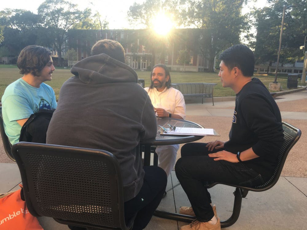 <p class="p1"><span class="s1">Students meditate outside of the University Center. The session was led by meditation coach Dinesh Kashikar.</span></p>
