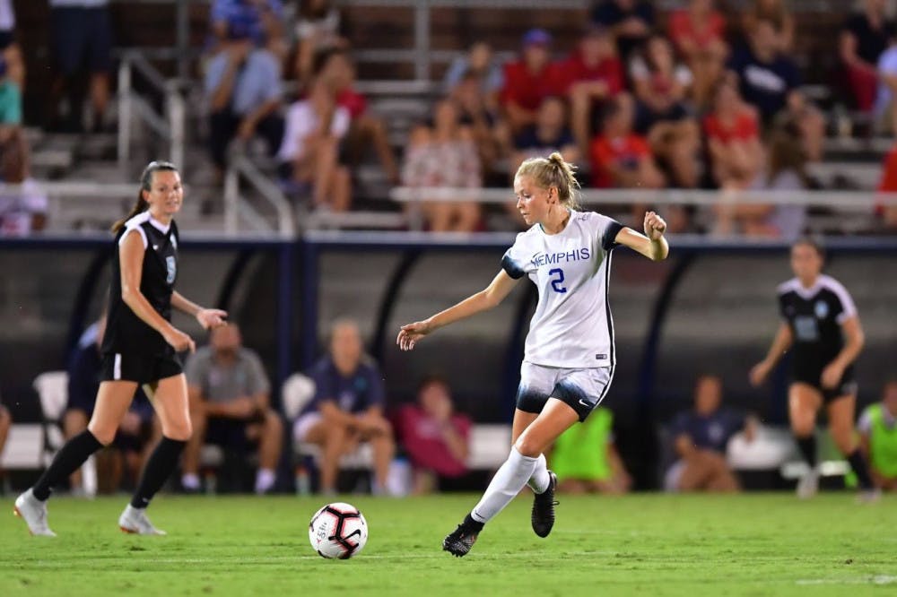 <p class="p1"><span class="s1">Serena Dolan drives pass a defender looking for a teammate. The women’s soccer team beat Ole Miss 2-0 to extend their winning streak and improve their rank to No. 12 in the nation.</span></p>