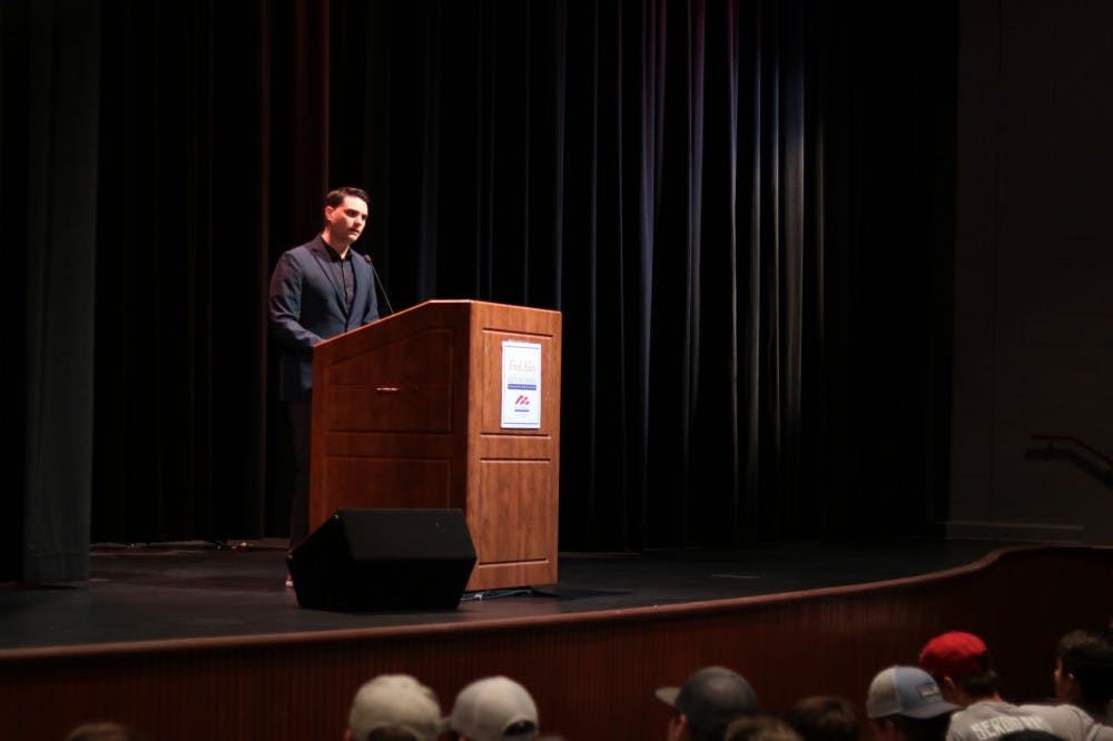 <p class="p1"><span class="s1"><strong>Controversial conservative speaker and editor-in-chief of <em>The Daily Wire</em> Ben Shapiro (left) speaks to a crowded Rose Theatre audience Wednesday afternoon. Shapiro, who was brought to campus by the University of Memphis chapter of Young Americans for Freedom (president Jocelynn Jordan on bottom right), spoke about issues of free speech and divisive political rhetoric.</strong></span></p>