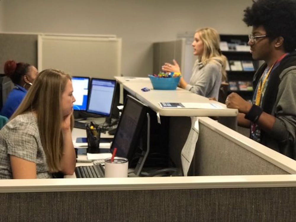 <p>University of Memphis FAFSA employees assist students with questions about their financial aid status. The government's shutdown has affected students who require forms of verification for their FAFSA.</p>