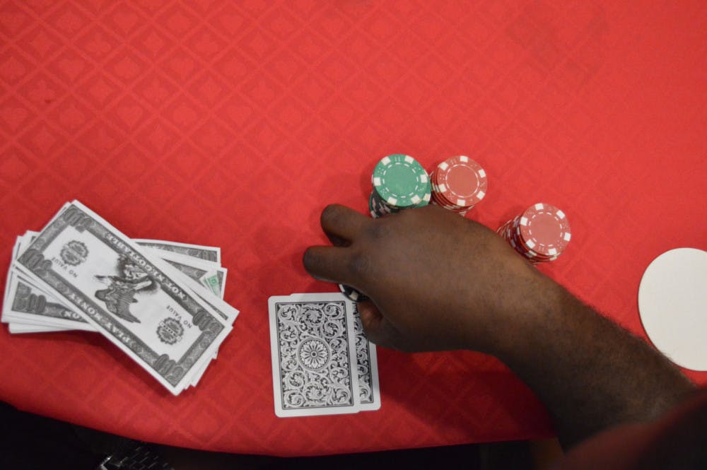 A Student Bets Chips during SAC's Casino Night