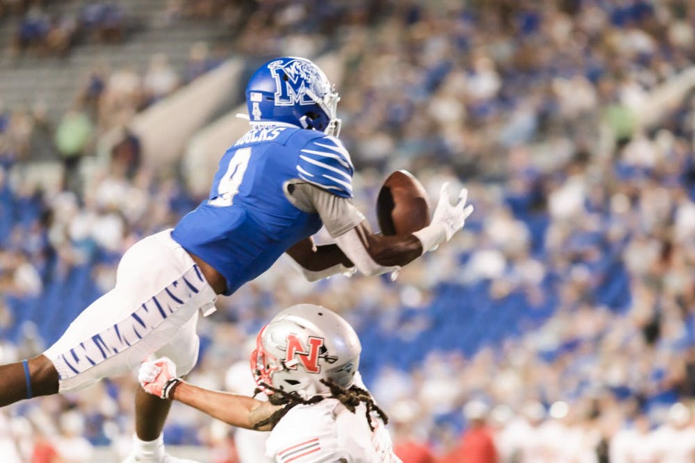 <p>Wide receiver Gabriel Rodgers, a redshirt senior, leaps to grab a pass from true freshman quarterback Seth Henigan. The Tigers would go on to defeat Nicholls State 42-17.</p>