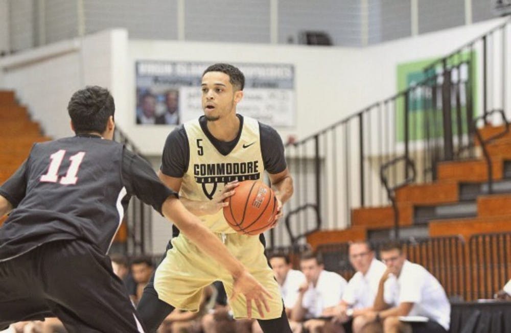 <p class="p1"><span class="s1">Matthew Fisher-Davis, point guard for Vanderbilt University, looks for a teammate in practice. Even though it can be difficult, Fisher-Davis said having good grades should be mandatory for all student-athletes.</span></p>