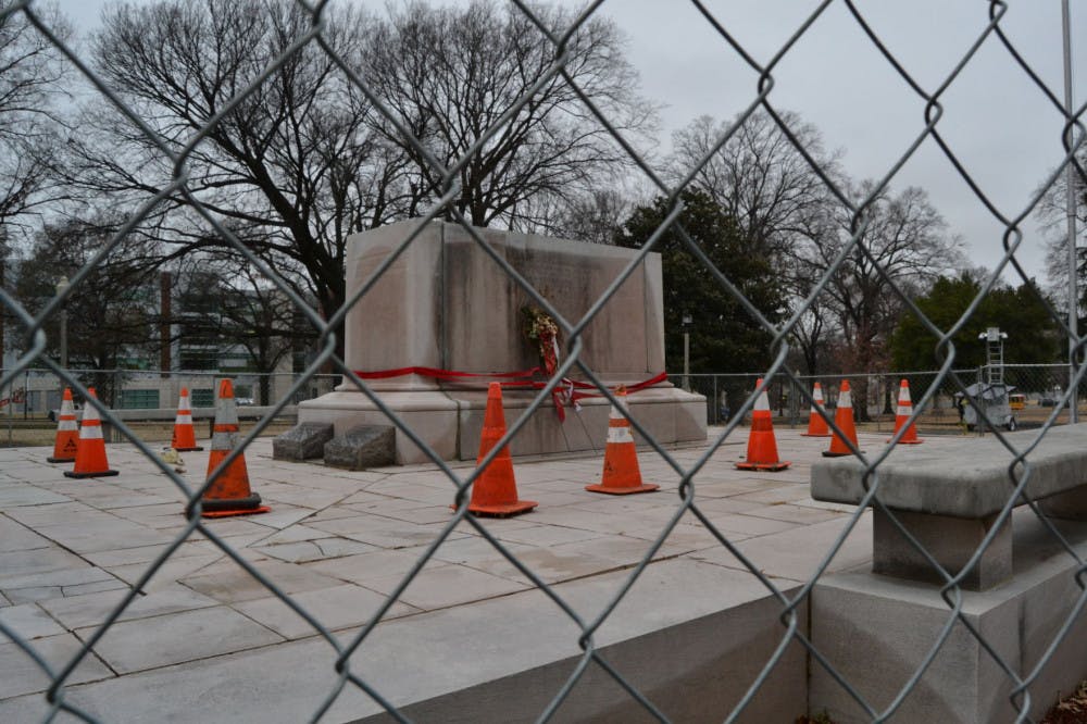 <p>The tombstone of Confederate General Nathan Bedford Forrest sits in Health Sciences Park without Forrest's statue on top after the statue was removed in late December 2017. The monument was blocked off to the public after the removal of the statue.</p>