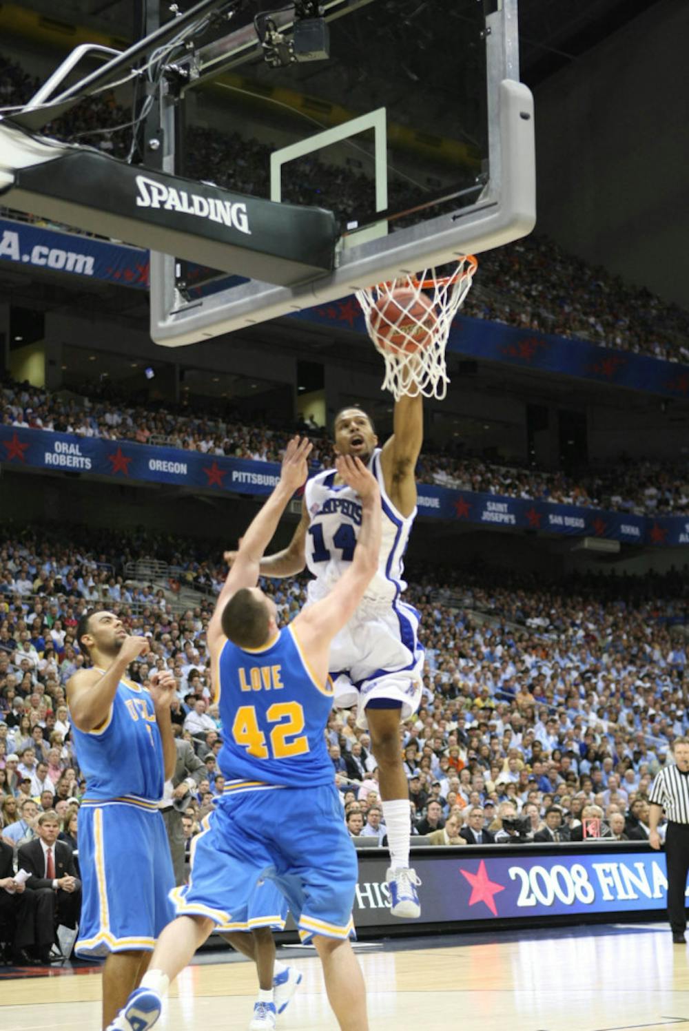 <p>Former Tiger basketball great Chris Douglas-Roberts dunking on former UCLA and current NBA star Kevin Love in the 2008 NCAA Final Four.&nbsp;</p>