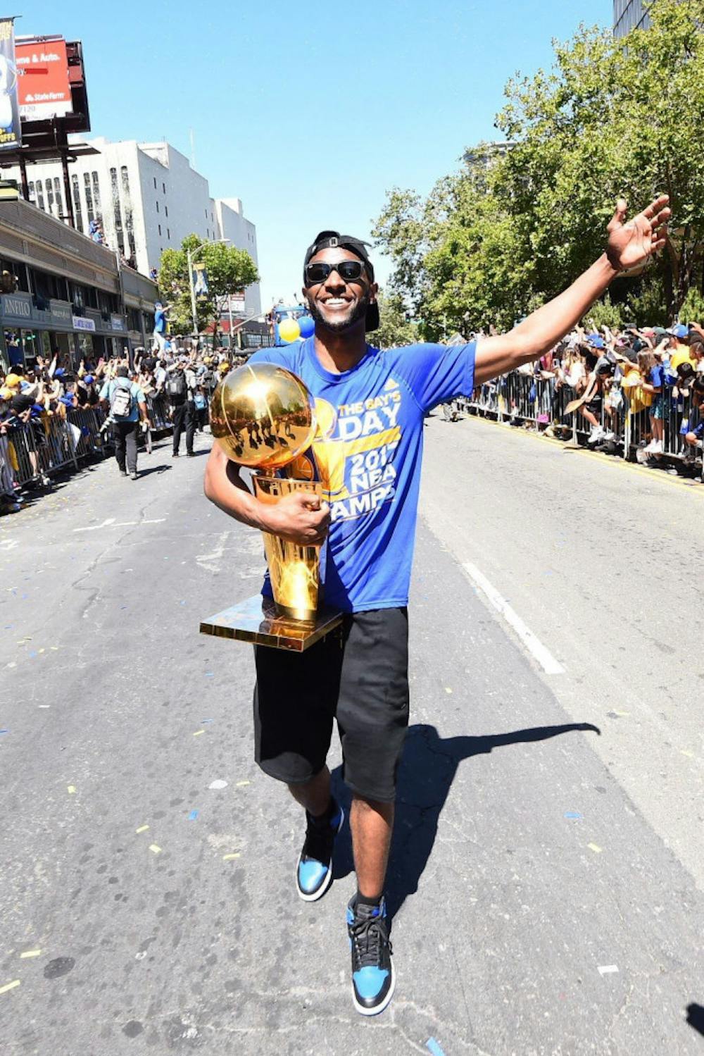 <p class="p1"><span class="s1">Germantwon High School alumnus Ian Clark holds the Larry O’Brien Trophy on June 15 in Oakland, California. The former Golden State Warrior has now signed with the New Orleans Pelicans.</span></p>