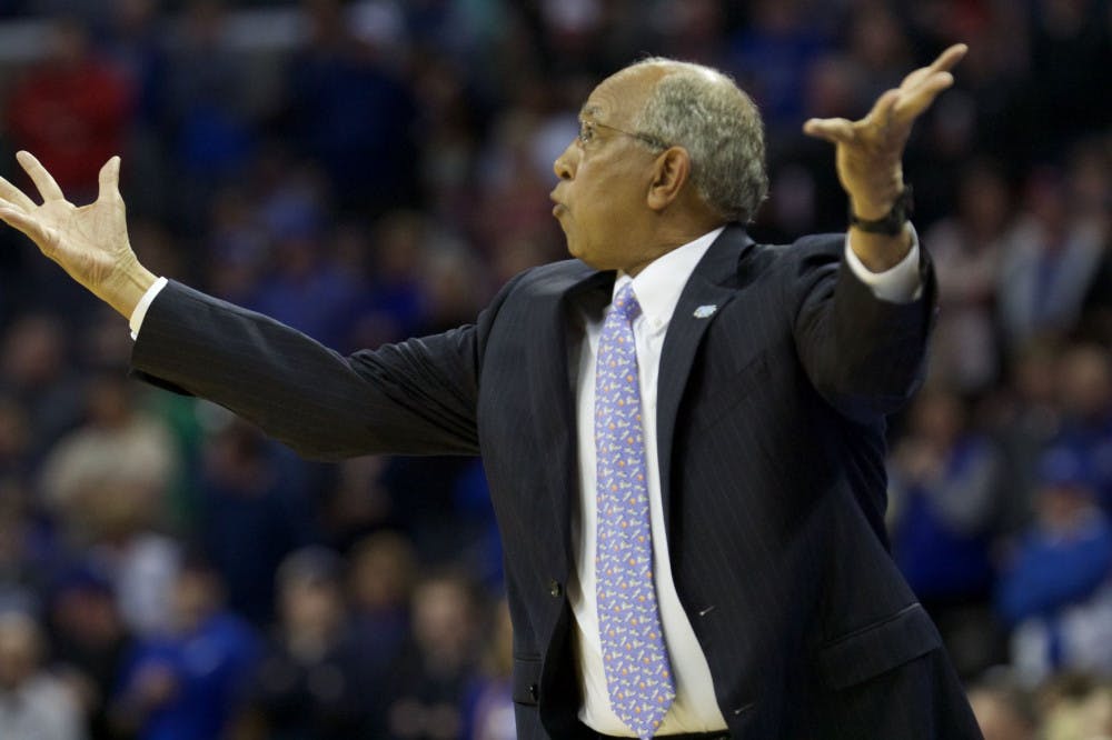 <p>Tubby Smith talks to his team from the sideline against Cincinnati. This is Smith's second season as Memphis' head coach</p>