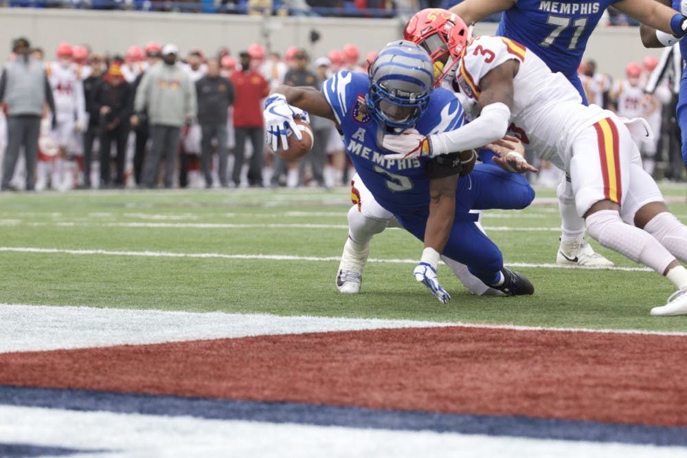 <p>Tigers' wide receiver, Anthony Miller, stretches over the goal line for a touchdown. Miller had one touchdown and 55 yards in his final game for Memphis.</p>