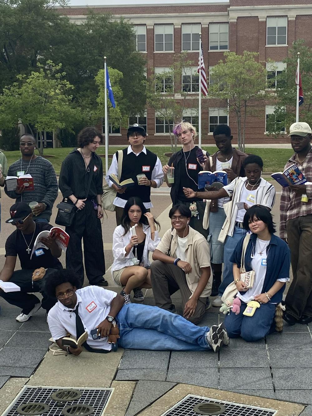 <p>Students pose with books and accessories during the University of Memphis Asian American Association’s first Performative Male Contest at the UC Fountain on Sept. 5.</p>