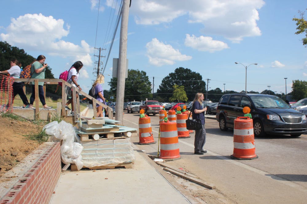 <p>Students crossed the road with construction problems. Southern Avenue construction is holding up students from their commute.&nbsp;</p>