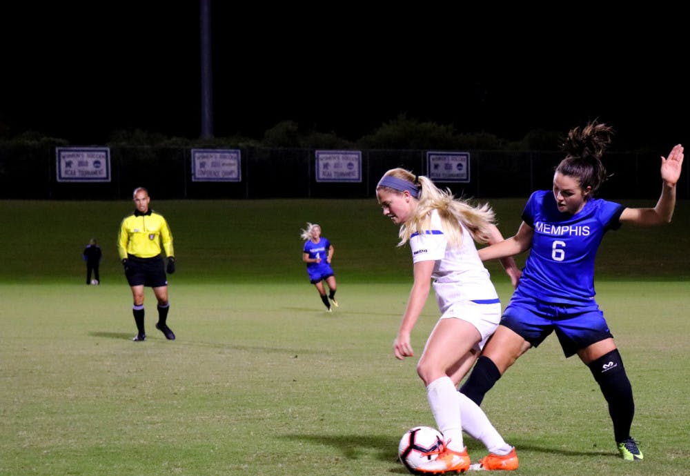 <p>Catherine Levasseur getting upper hand to win ball back from Tulsa player. Levasseur is one of five seniors that were honored in their last game of the regular season last Friday night.&nbsp;</p>