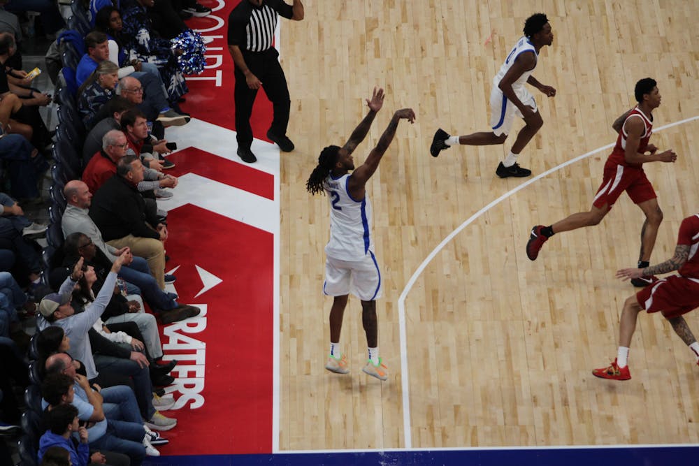 Memphis wing Zachary Davis shoots a three-pointer in the second half of the Tigers' exhibition game against Arkansas at FedExForum Monday night.
