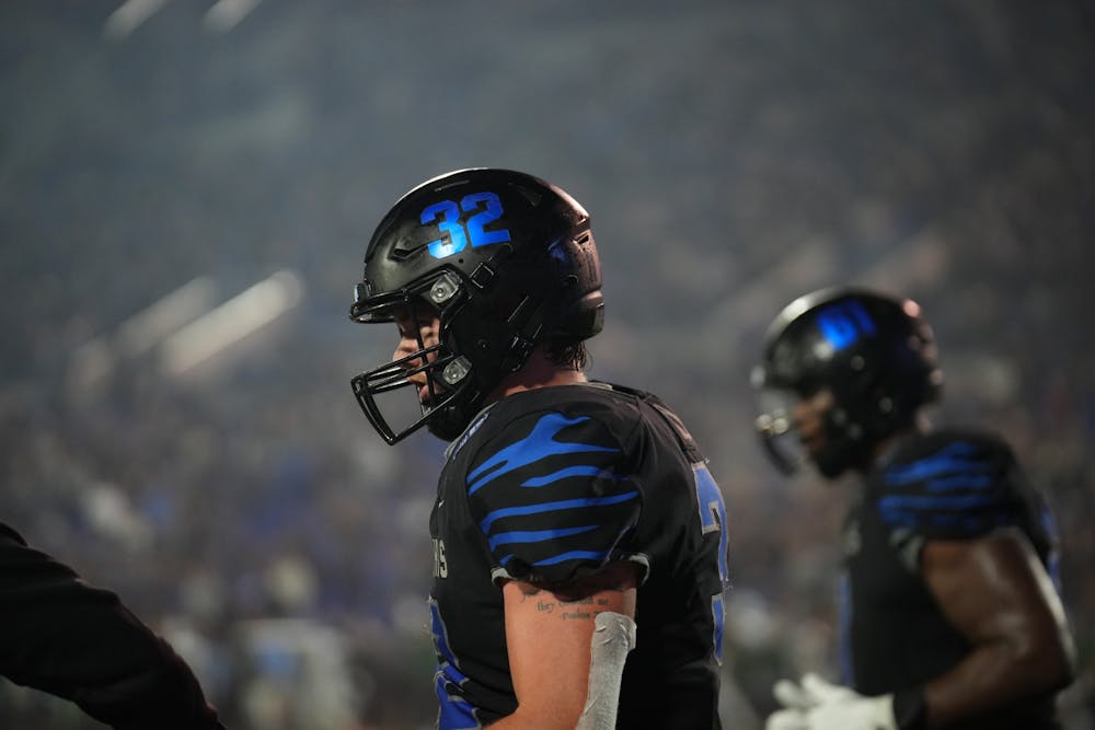 Memphis tight end Matt Adcock walks out onto the field at Simmons Bank Liberty Stadium before his Tigers' 38-32 loss to Tulane Friday night.
