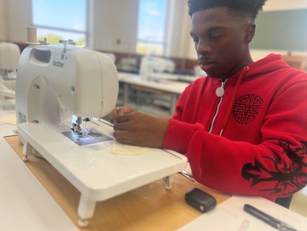 <p>University of Memphis fashion design student TJ Jordan, works on a project in the Manning Hall lab.</p>