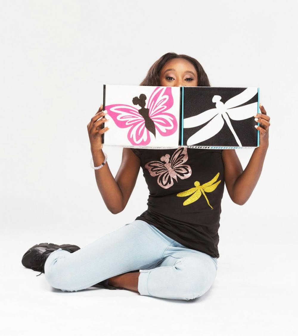 <p class="p1"><span class="s1">Journi Prewitt shows off boxes to be sent to young black boys and girls to encourage them to read. Black Butterfly Beautiful offers subscription boxes to young black children from ages 4 to 19 and boxes for college students.</span></p>