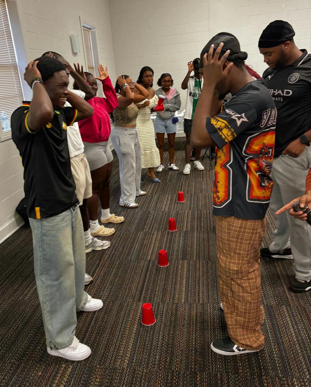 <p>Students from the African Student Association compete in a cup-stacking game.</p><p><br/><br/></p>
