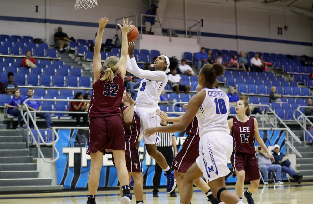 <p>Williams drives the lane and goes up for a floater as Cheyenne Creighton moves into position for the offensive rebound. Creighton leads the team with 72 offensive boards.</p>