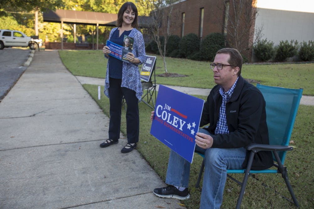 <p>Campaigners greet voters going to the polls outside the polling station at Evangel Church in Memphis. Many people voting Tuesday said health care was the reason they voted.</p>