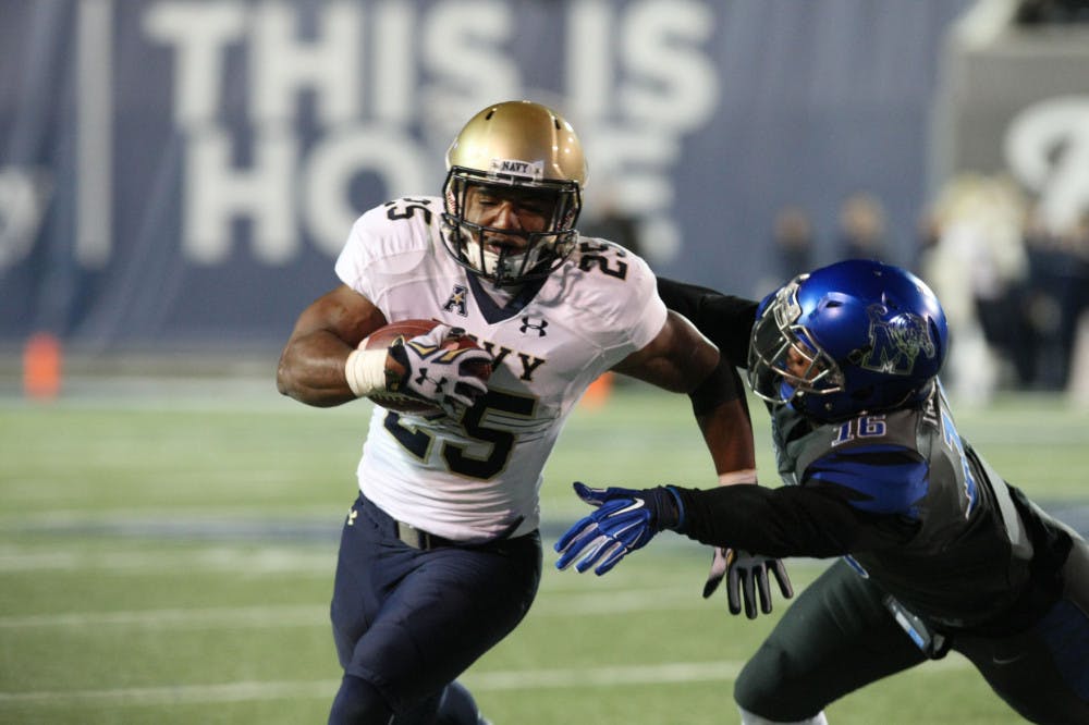 <p>Demond Brown (25), who rushed for 40 yards and a touchdown last season against Memphis, evades a tackle during Navy’s 45-20 victory over the Tigers in 2015. Navy lost some of their big-name players to graduation, but Memphis fans should expect much of what they saw last year again from the Midshipmen this season.</p>
