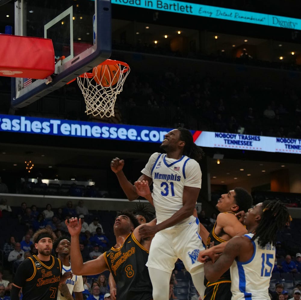 <p>Memphis big Thierno Sylla watches the ball go through the basket in the Tigers&#x27; 76-70 win over San Francisco Saturday at FedExForum.﻿</p>