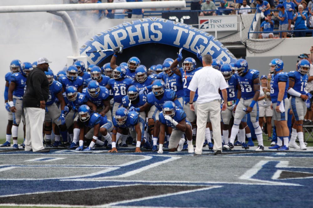 <p>The Memphis Tigers gather in the tunnel to take the field for their 43-7 win over the Kansas Jayhawks.</p>