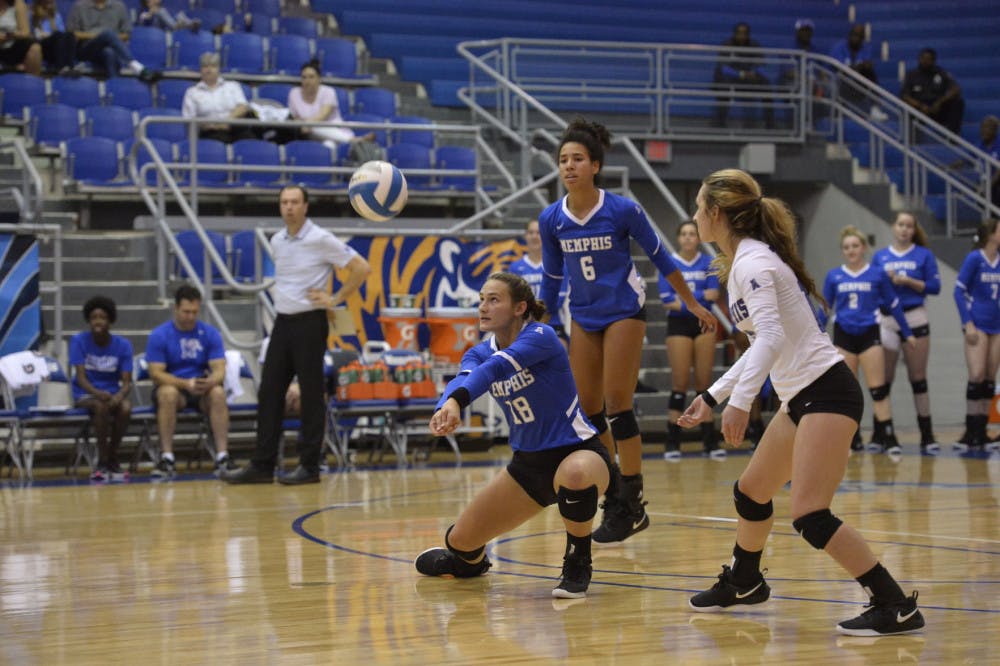 <p>Kaitlyn Gehler (18) digs for the ball. The Memphis Tigers won the Saluki Invitational to improve to a 9-0 record.</p>