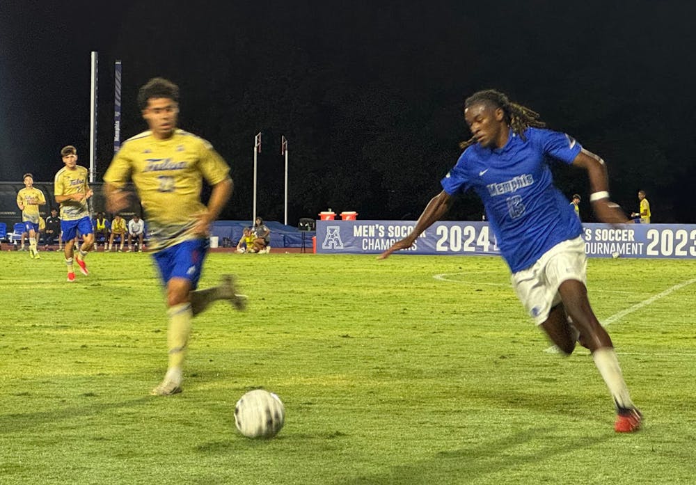 <p>Memphis defender Ryan Ruguaru dribbles by a Tulsa defender in the Tigers&#x27; 3-2 win Saturday night.﻿</p>