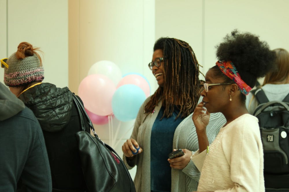 <p>Patricia Thomas (Left) and Nikkino Wesson (Right) discuss pronouns and inclusivity with U of M students. In observance of International Pronouns Day, the U of M community dedicated Wednesday to be more inclusive and understanding about people's pronouns.</p>
