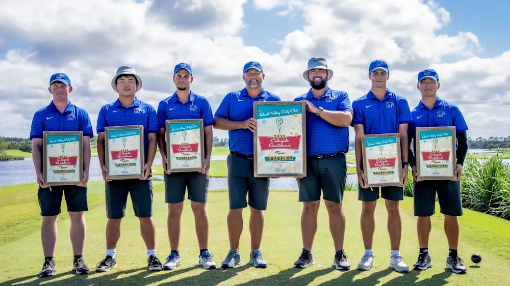 The Memphis men's golf team poses with their first place awards after they won the Quail Valley Collegiate tournament Monday in Florida.