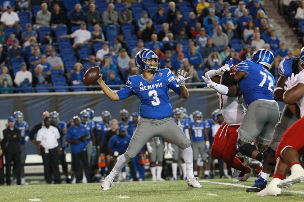 <p>Brady White looks for an open receiver downfield. White had two touchdowns and led the Memphis Tigers to a 52-35 victory over South Alabama.</p>