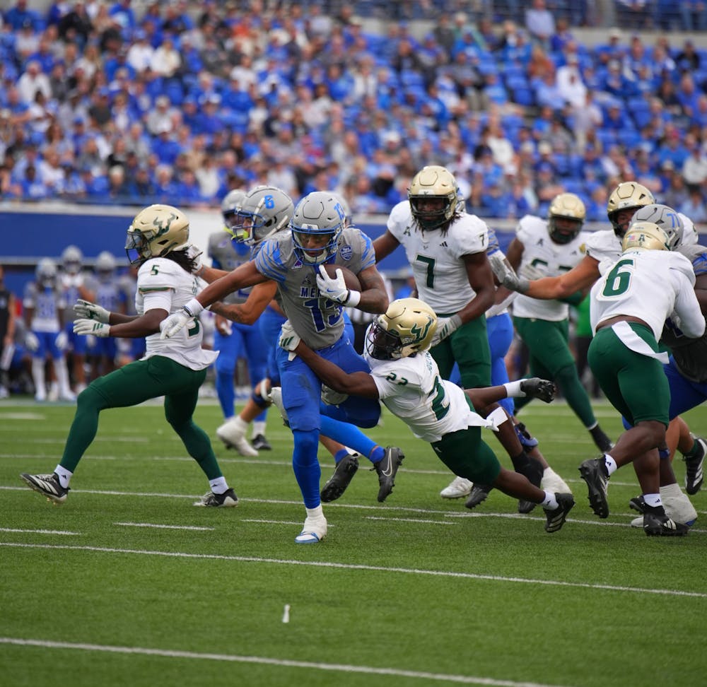 <p>Memphis running back Greg Desrosiers Jr. breaks a South Florida tackle in the Tigers&#x27; 34-31 victory over the Bulls Saturday at Simmons Bank Liberty Stadium.﻿</p>