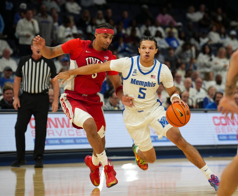 <p>Memphis guard Curtis Givens III dribbles by a UNLV defender in the Tigers&#x27; 92-78 loss to the Runnin&#x27; Rebels Sunday afternoon at FedExForum.﻿</p>