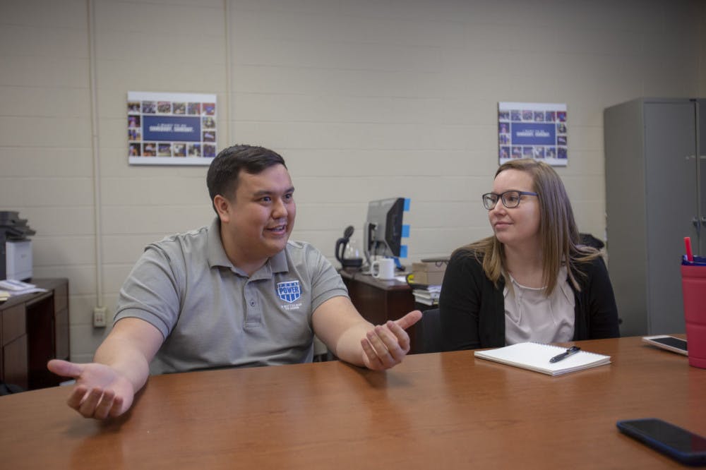 <p>Chris Xa, a representative for Peer Power speaks with reporters for the Daily Helmsman on Tuesday. Peer Power is a collaboration between the University of Memphis and Shelby County Schools&nbsp;to foster an environment of success for both the coaches and students.</p>