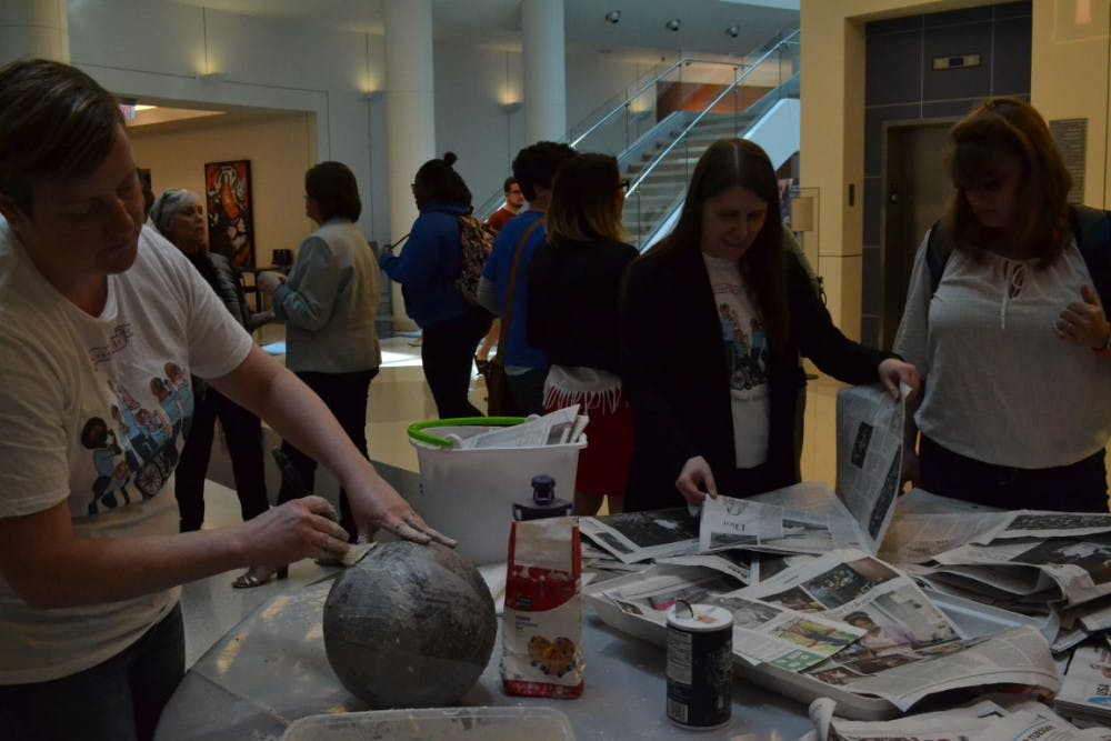 <p class="p1">The Feminist Fair for Women’s history month drew in a large crowd at the University Center Atrium on Monday. Students tried to recreate Michelangelo Pistoletto’s Sculpture for Strolling by attaching newspaper articles about feminism to the sculpture.</p>
