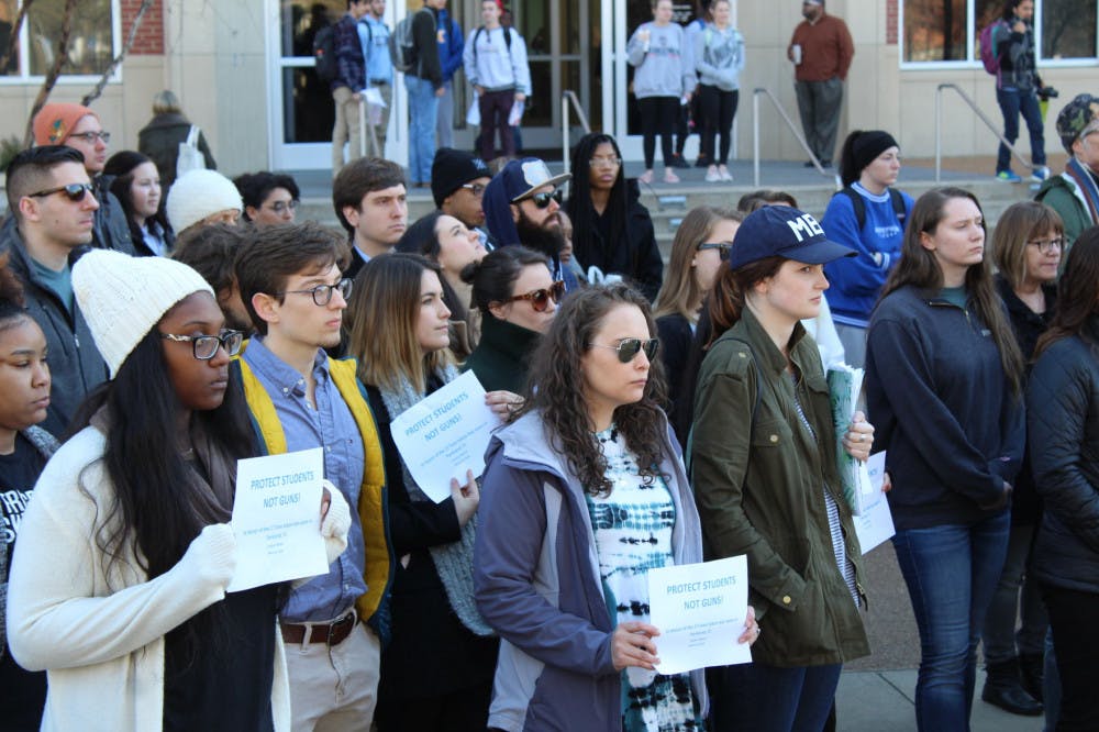 <p>More University of Memphis students came out to help protest bringing along their own signs. A whole class, plus their professor, came out of their building to join the walk out.&nbsp;</p>