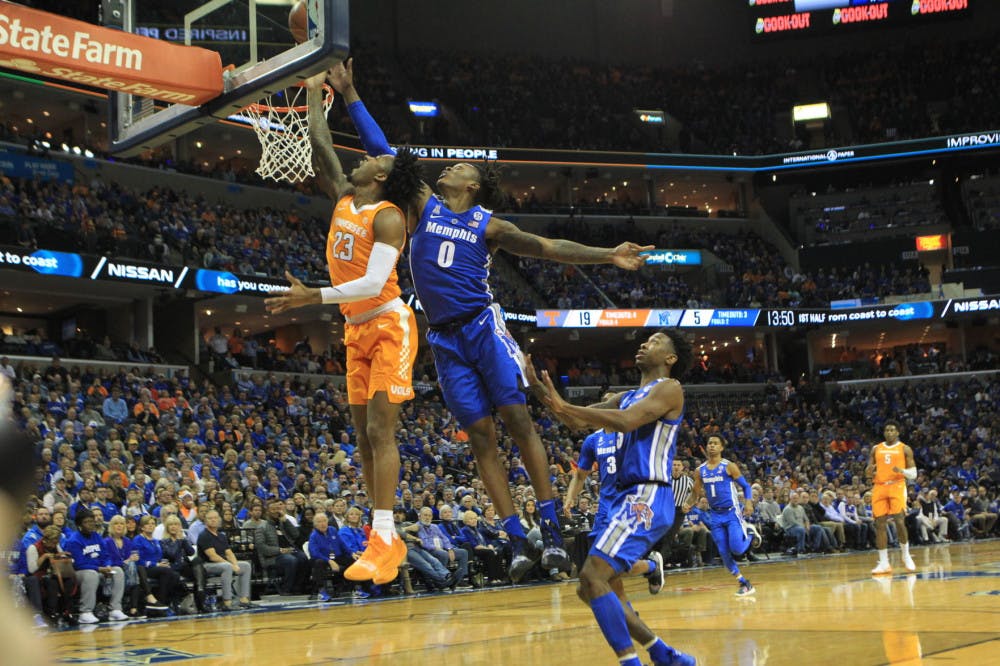 <p>Kyvon Davenport contests a layup by a Jordan Bowden. Davenport led the team with 31 points and 11 rebounds in the 102-92 loss.</p>