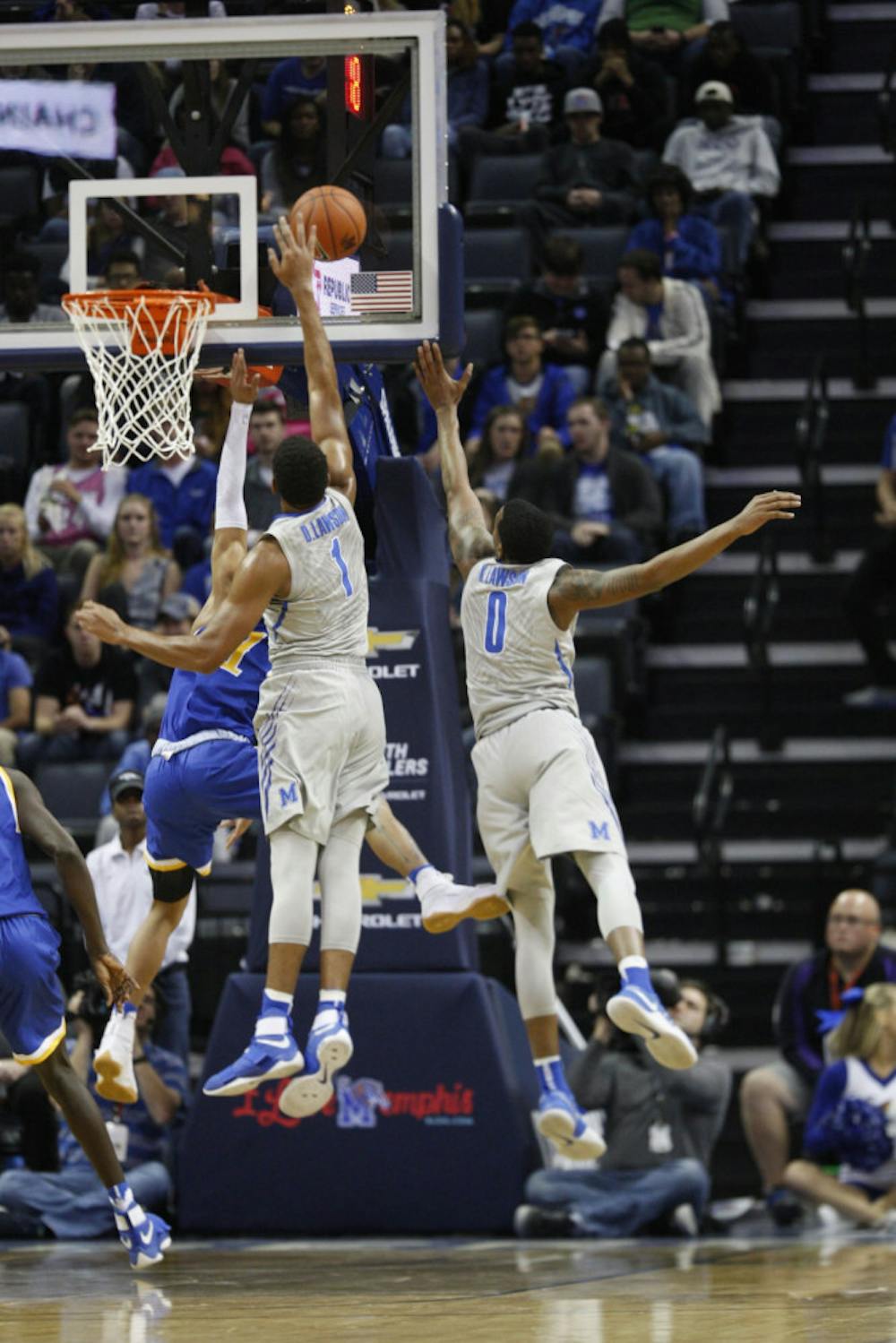<p>Dedric Lawson (1) jumps to block a shot in the win against McNeese State. Lawson is third in the AAC with 51 blocks this season.</p>