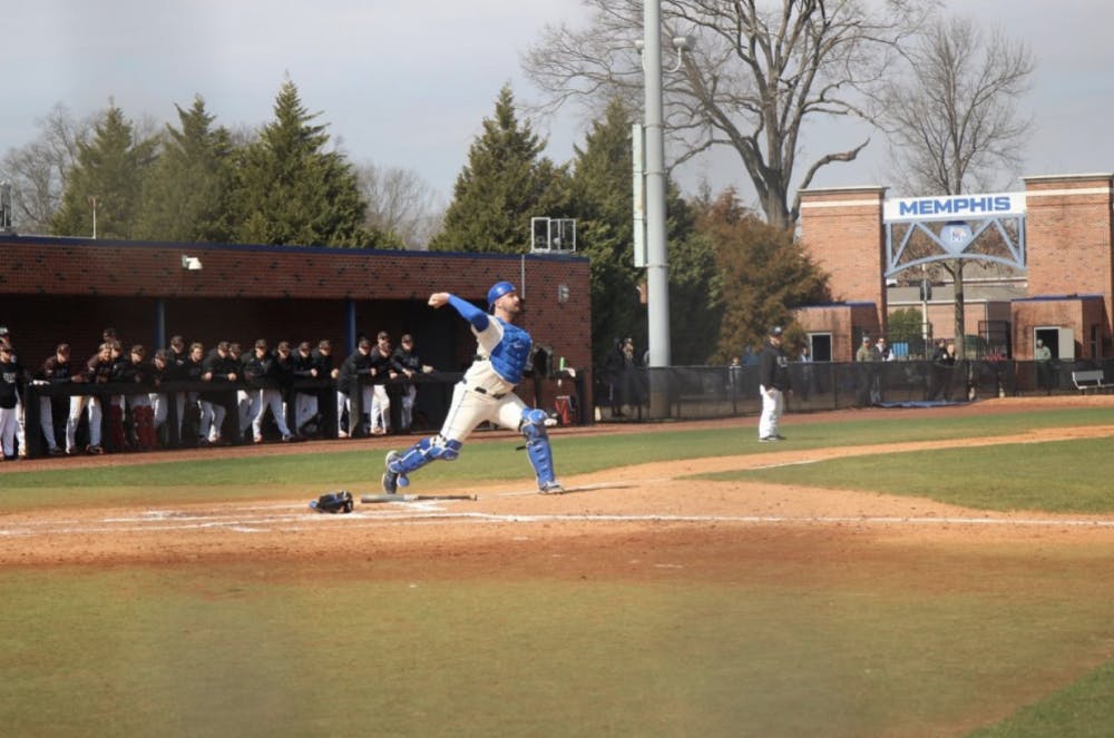 <p><span>Catcher Tanner Booth, #32, recovers a low pitch and makes a play to end the inning in a game against Brown on 2/27. Brown would go on to win the game 7-6 despite another Memphis comeback.</span></p>