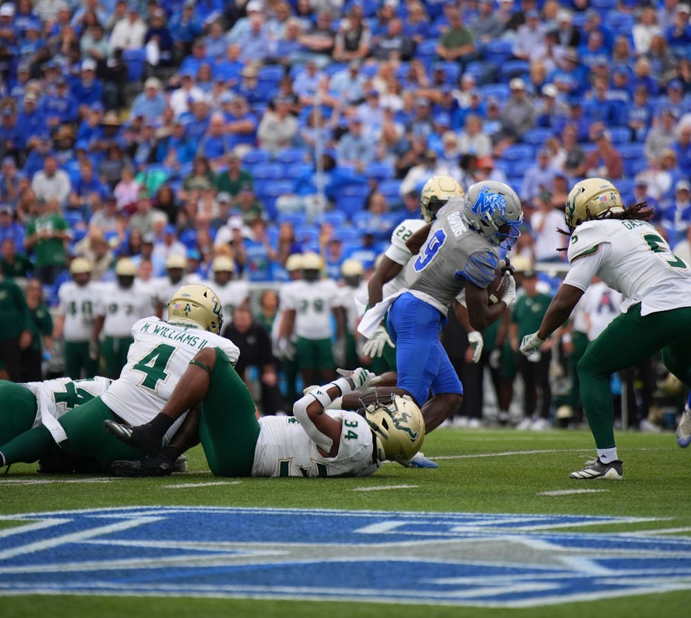<p>Memphis receiver Jamari Hawkins runs through the USF defense in the Tigers&#x27; 34-31 win against South Florida Saturday at Simmons Bank Liberty Stadium.﻿</p>