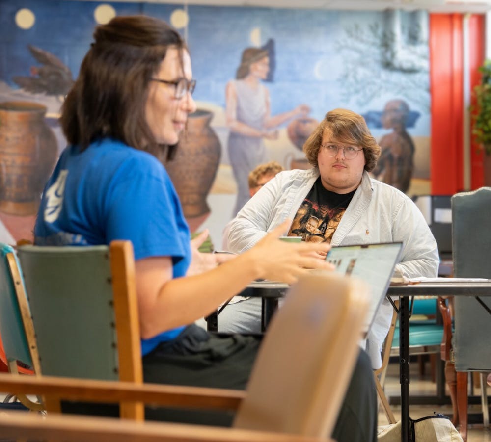 <p>Vice President Everett Sego and Advisor Amanda Savage discuss the goals of Student History Society with interested students.</p>