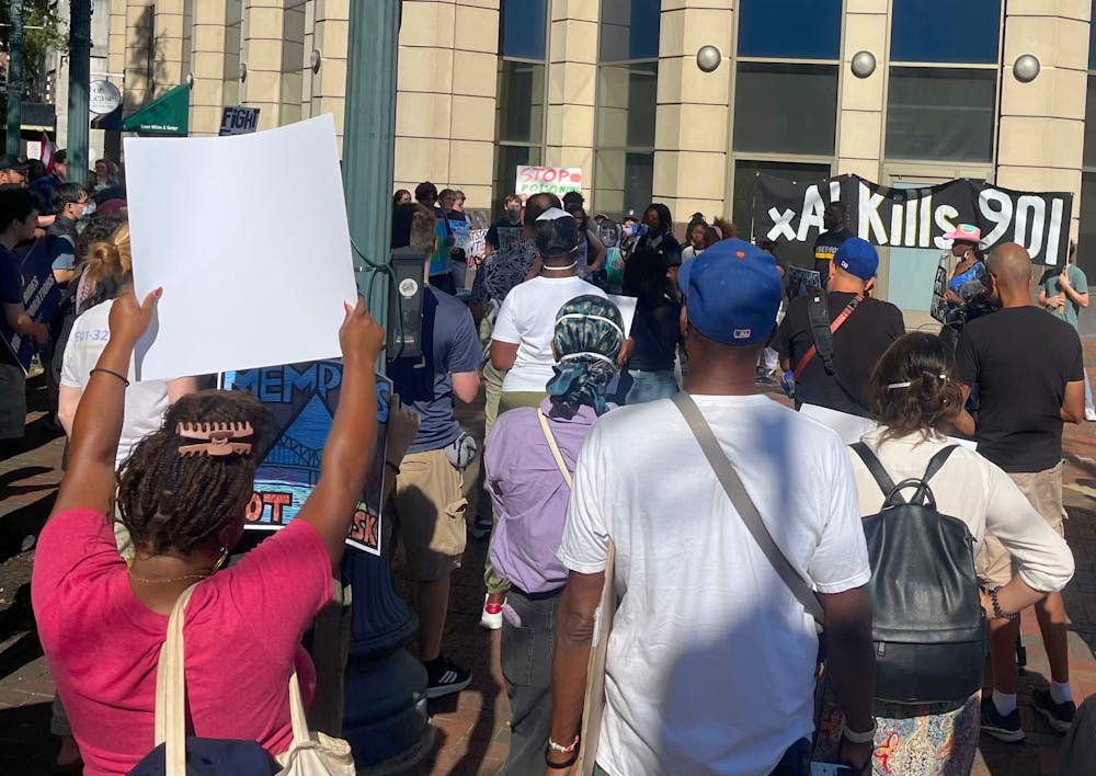 <p>Protesters march near Peabody Avenue and Main Street in downtown Memphis during a demonstration against xAI and the Memphis Safe Taskforce on Saturday.</p>
