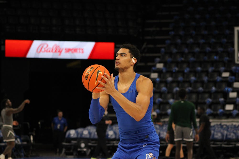 Lone returner, Nick Jourdain, warms up before Memphis' game against UAB at FedExForum last season.