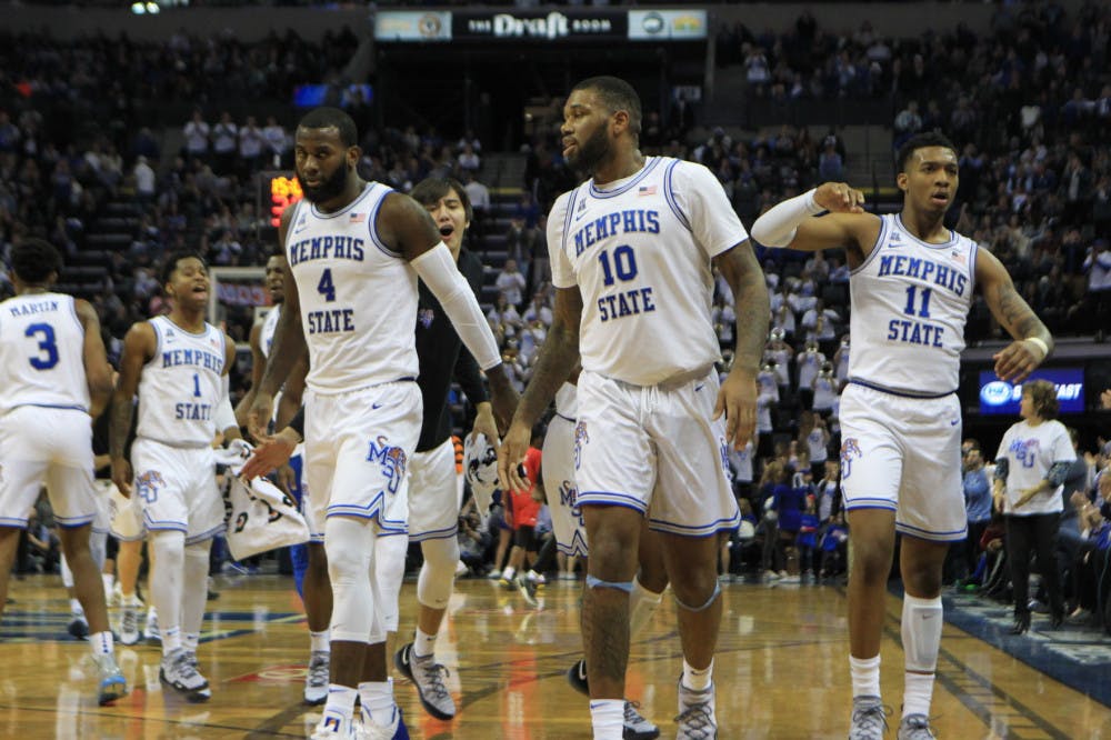 <p class="p1"><span class="s1"><strong>Mike Parks (10) and his teammates Antwann Jones (11) and Raynere Thornton (4) walks off the court as they celebrate. The last time the Tigers faced Cincinnati, they lost 66-62.</strong></span></p>