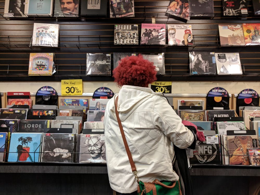 <p><strong>Ashli King looks at Spin Street's vinyl selection.</strong></p>