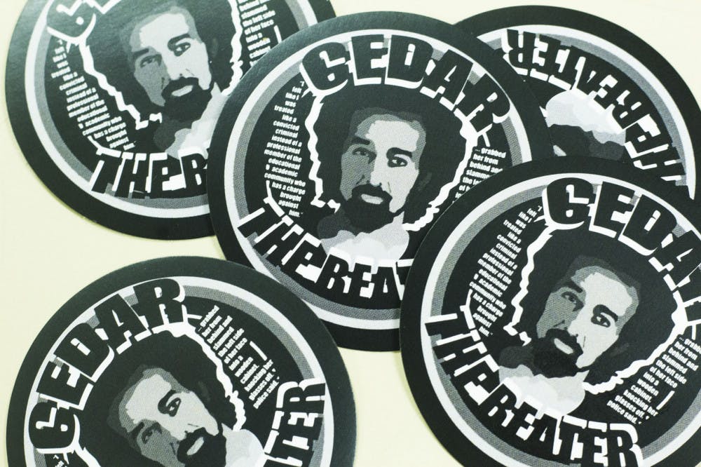 <p>Stickers made by Ethan Delgado, a graphic design student and former pupil of Nordbye, call U of M professor Cedar Nordbye a "beater."&nbsp;</p>
<p>The stickers' left side has a quote from Nordbye. "I felt like I was treated like a convicted criminal instead of a professional member of the education and academic community who has a charge brought against him," he told the Daily Helmsman during an interview.&nbsp;</p>
<p>The right side of the sticker has a excerpt from the Helmsman article. "'... grabbed her from behind and slammed the left side of her face into a wodden cabinet knocking her glasses off,' police said."</p>